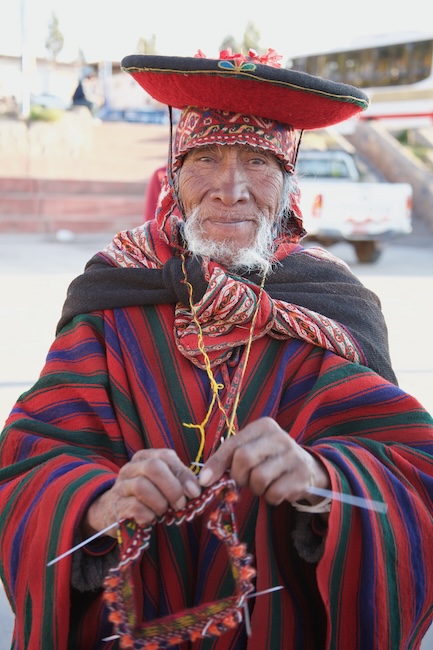 Peruvian man knitting
